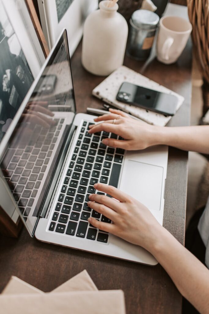 crop female freelancer using laptop at table at home → blogidmwebid pexels photo 4050312