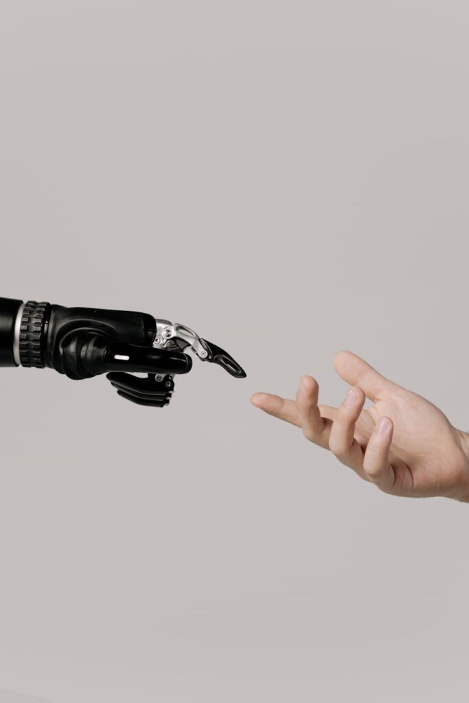hand of a person and a bionic hand → blogidmwebid pexels photo 6153343